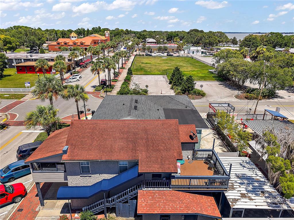107 West Main Street Tavares, FL 32778 - Photo 8 of 10 an aerial view of residential houses with outdoor space and swimming pool