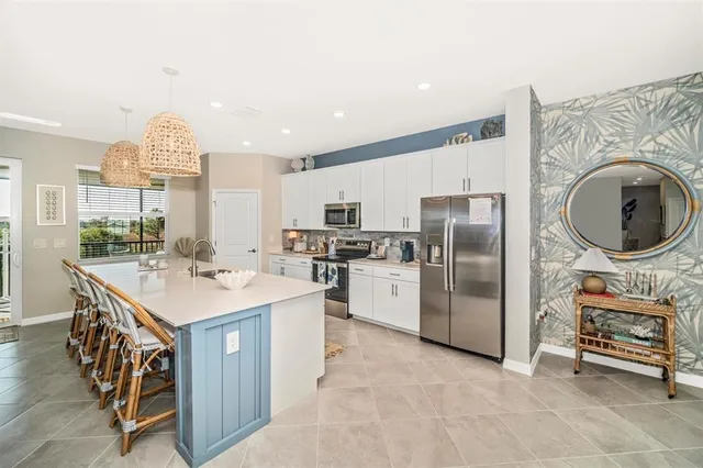 a bedroom with a large bed and a flat screen tv