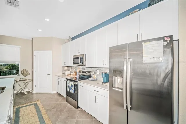 a bed room with a bed and a chandelier