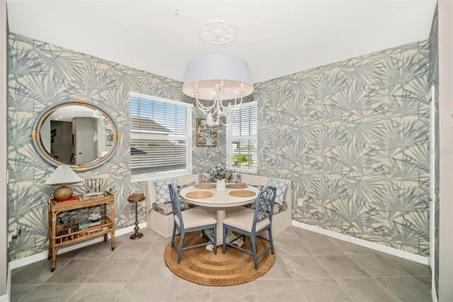 a bathroom with a sink a toilet and shower curtain
