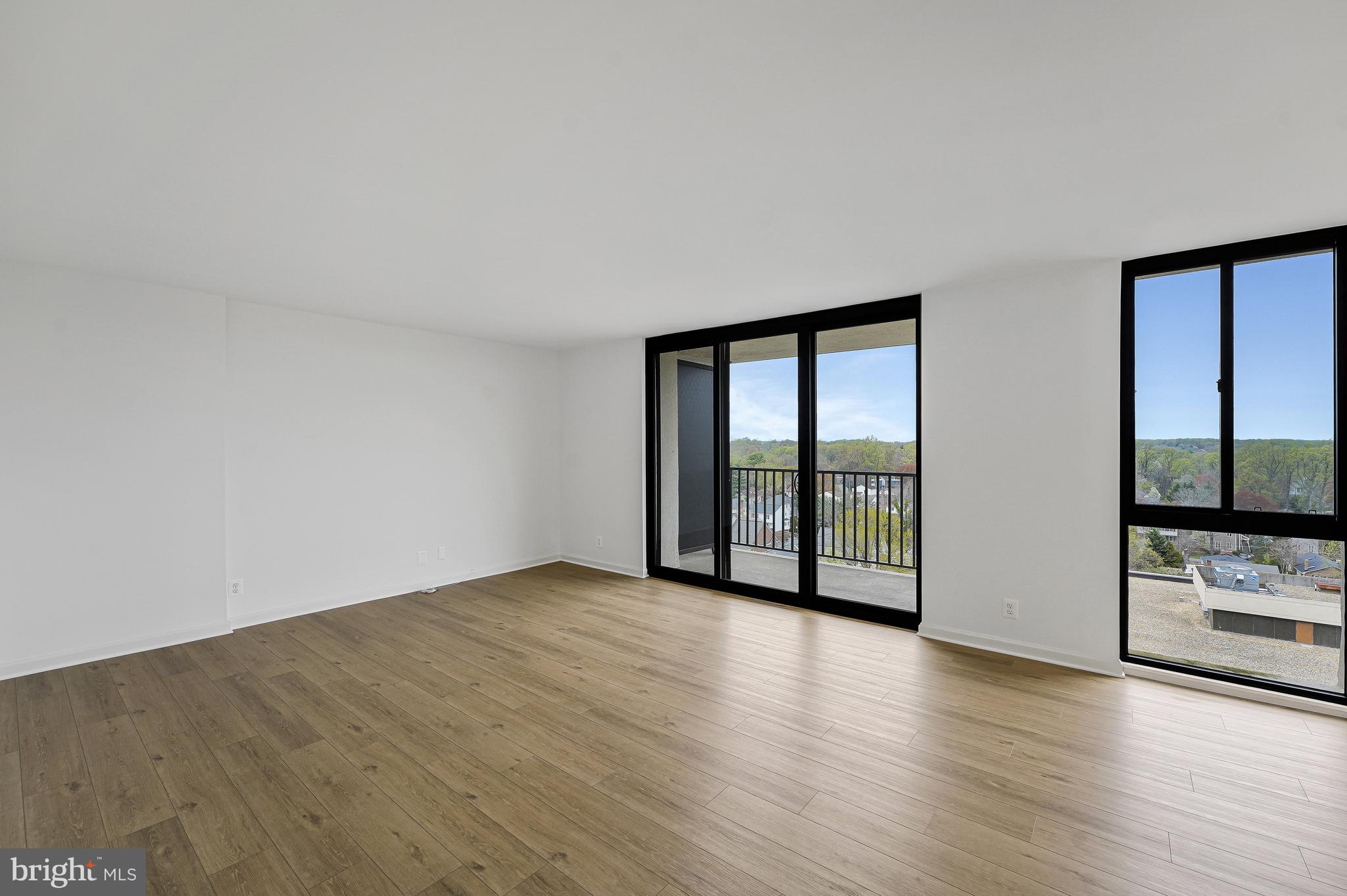 6800 Fleetwood Road, Unit 1013 McLean, VA 22101 - Photo 12 of 32 a view of an empty room with glass door and balcony
