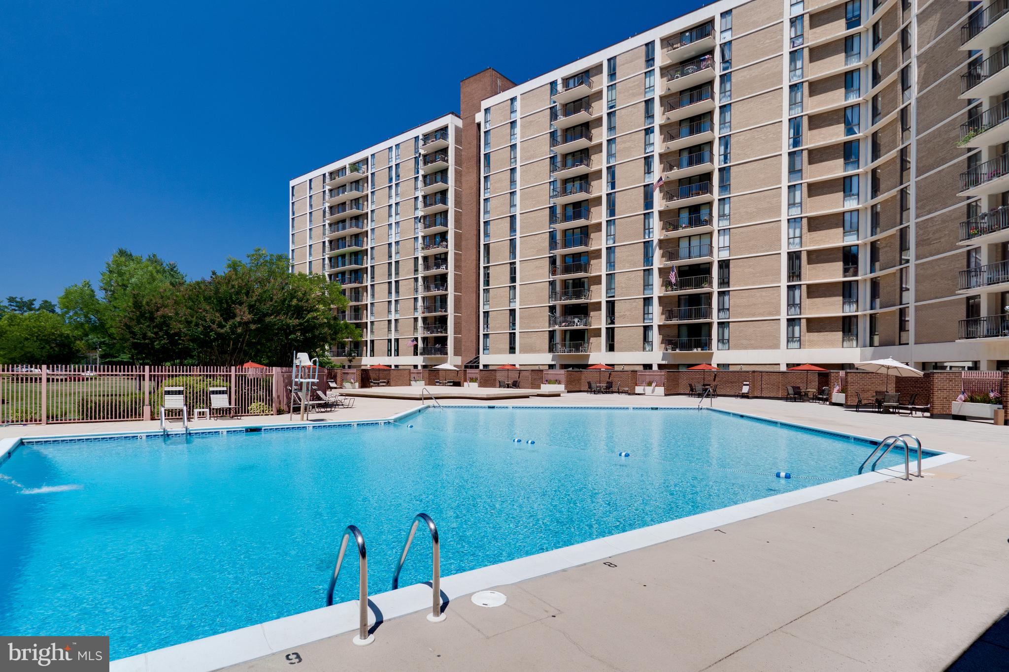 6800 Fleetwood Road, Unit 1013 McLean, VA 22101 - Photo 28 of 32 a view of building with swimming pool and outdoor seating