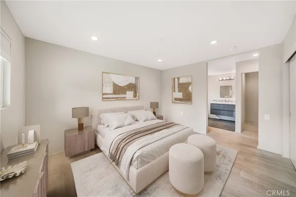 a bedroom with a bed and a couch