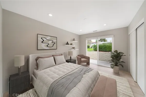 a bedroom with a large bed and a large window