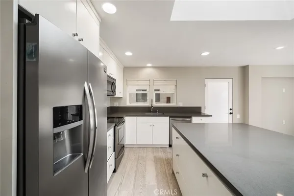 a kitchen with a stove and a microwave