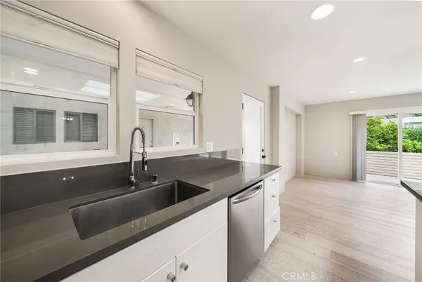 a kitchen with appliances and cabinets