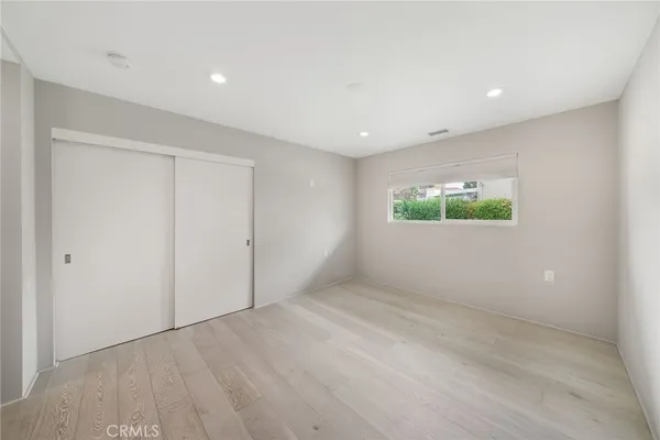 a bathroom with a double vanity sink mirror and toilet
