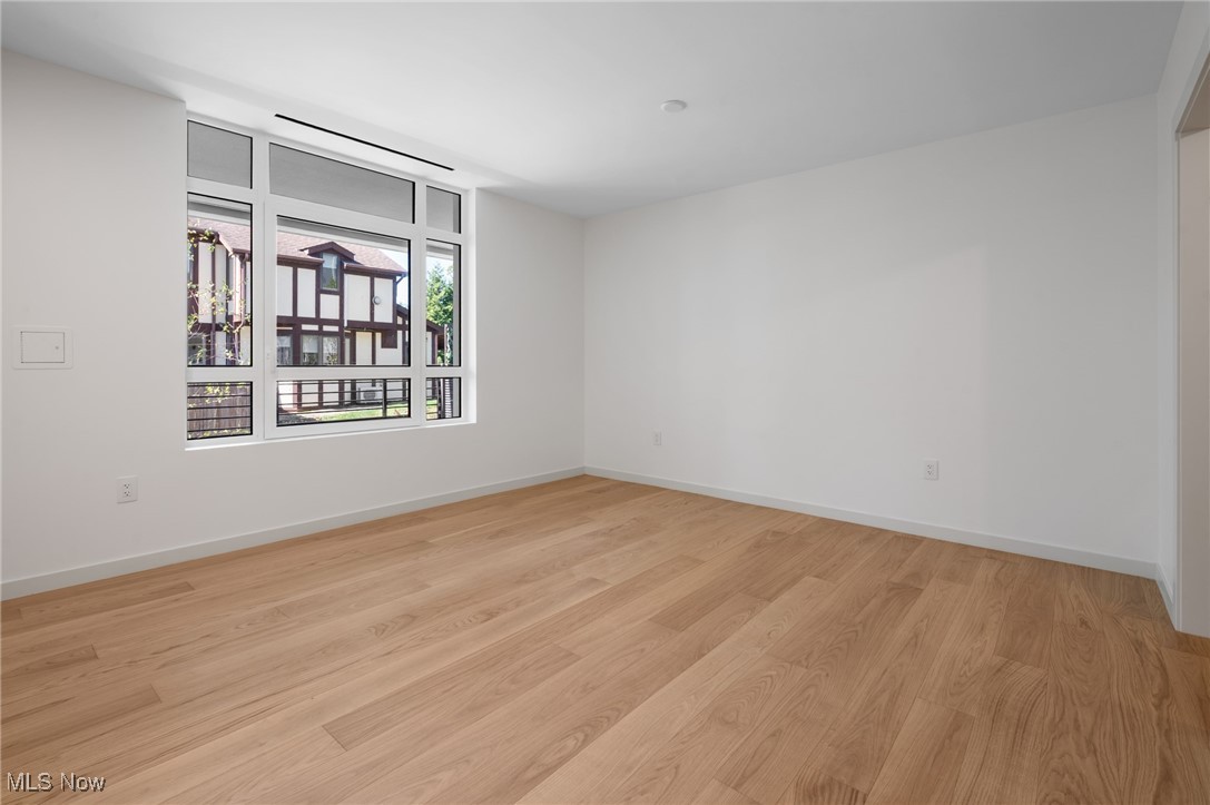 22700 Lake Road, Unit 306 Rocky River, OH 44116 - Photo 24 of 28 Empty room featuring light wood-style flooring and baseboards