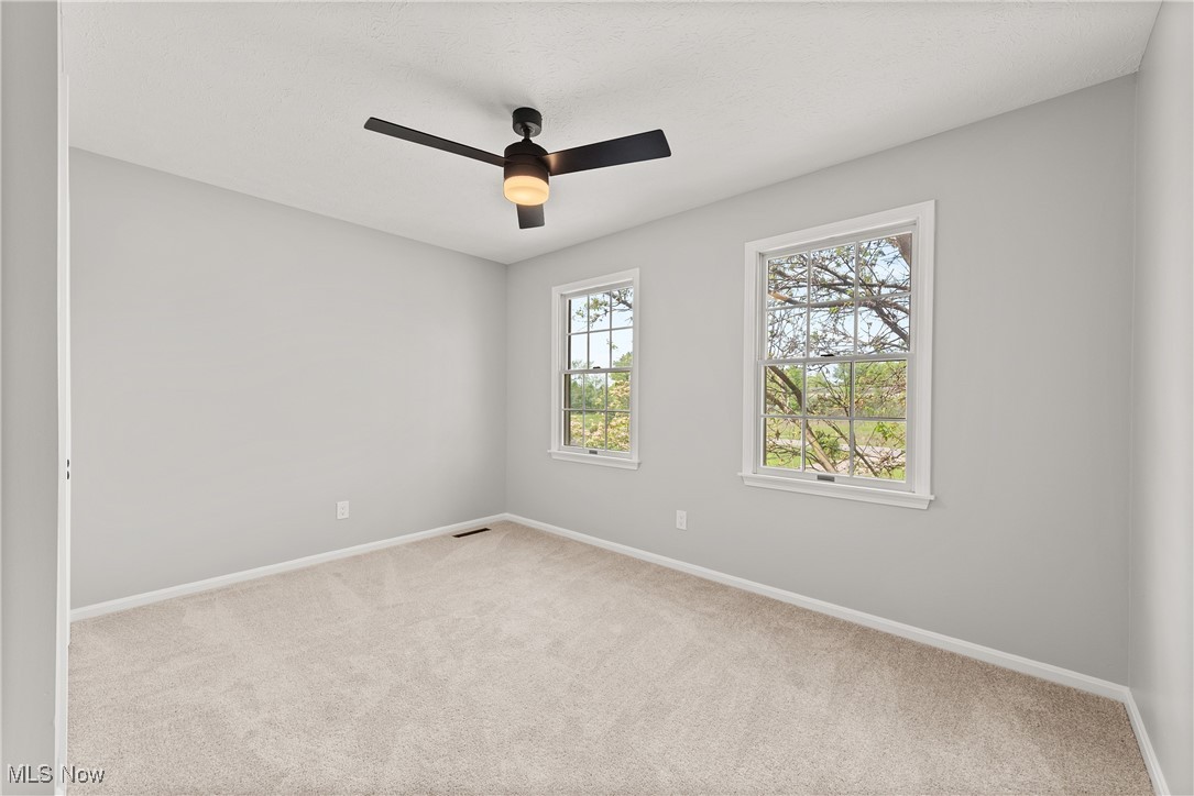 8080 Fair Road Strongsville, OH 44149 - Photo 35 of 50 Carpeted empty room with baseboards and a ceiling fan