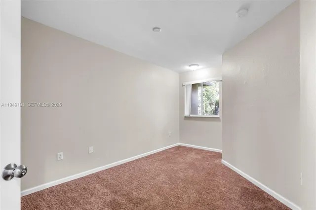 a bathroom with a granite countertop sink toilet a mirror and shower
