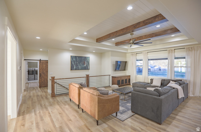 126 North 800 West Mapleton, UT 84664 - Photo 28 of 79 Living room featuring ceiling fan, recessed lighting, light wood-style flooring, a barn door, and a wood ceiling with exposed beams