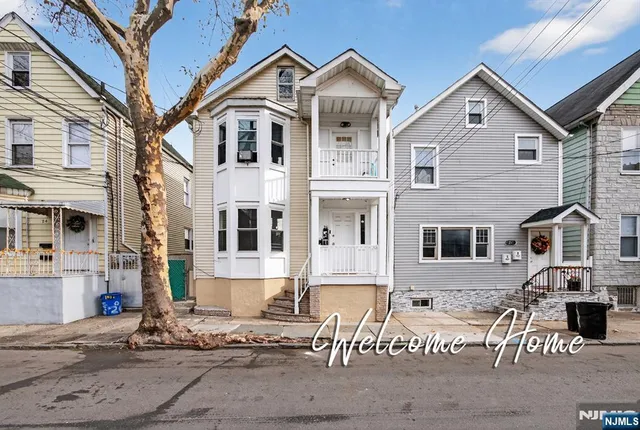 a front view of a house with a yard