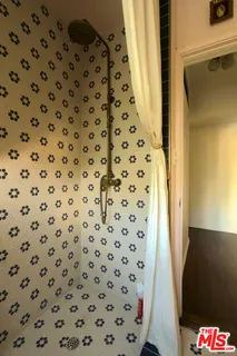 a front view of a building with a table and chairs