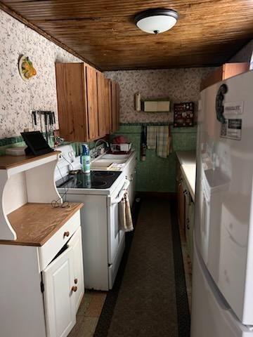 245 Higgins Road Hilliards, PA 16040 - Photo 12 of 13 a kitchen with a sink and a stove
