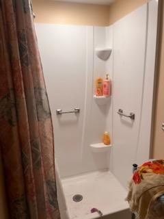 245 Higgins Road Hilliards, PA 16040 - Photo 9 of 13 a bathroom with a bathtub and a shower
