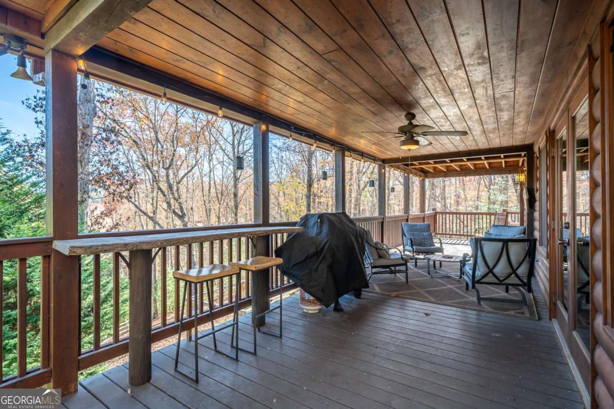 165 Christian Crossing, Unit 15 Morganton, GA 30560 - Photo 17 of 58 a living room with furniture and a large window
