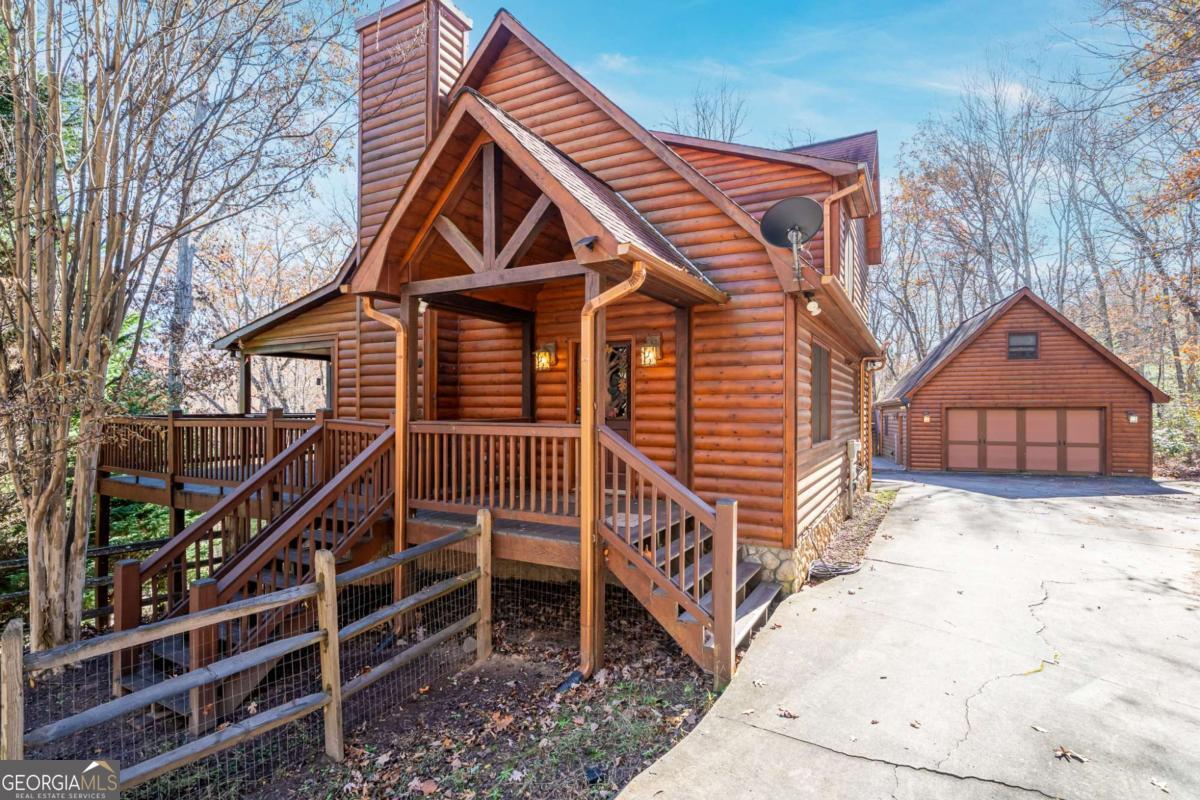 165 Christian Crossing, Unit 15 Morganton, GA 30560 - Photo 2 of 58 a view of a house with wooden fence