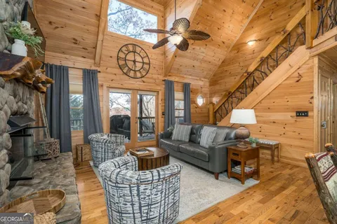 a kitchen with granite countertop kitchen island stainless steel appliances a refrigerator a sink a stove and cabinets