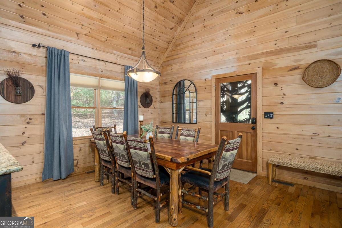 165 Christian Crossing, Unit 15 Morganton, GA 30560 - Photo 25 of 58 a view of a dining room with furniture and chandelier