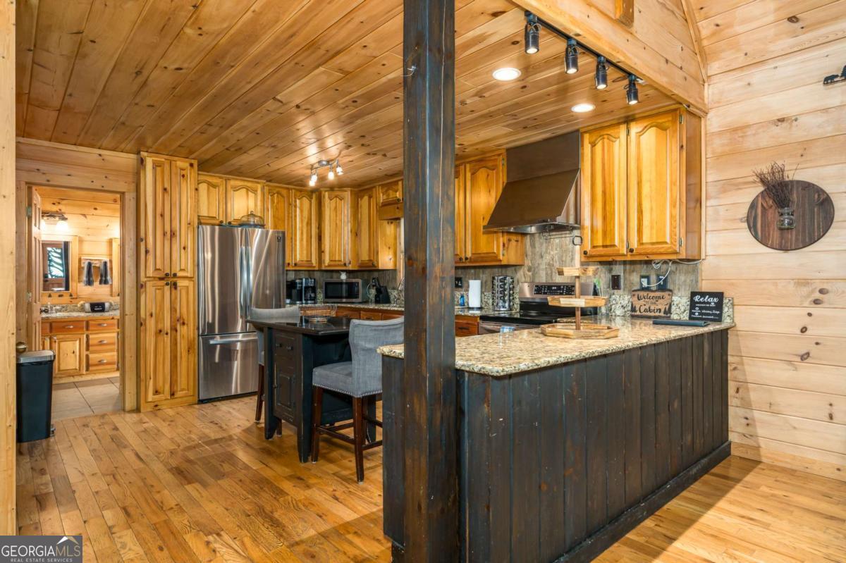 165 Christian Crossing, Unit 15 Morganton, GA 30560 - Photo 27 of 58 a kitchen with counter top space and a sink
