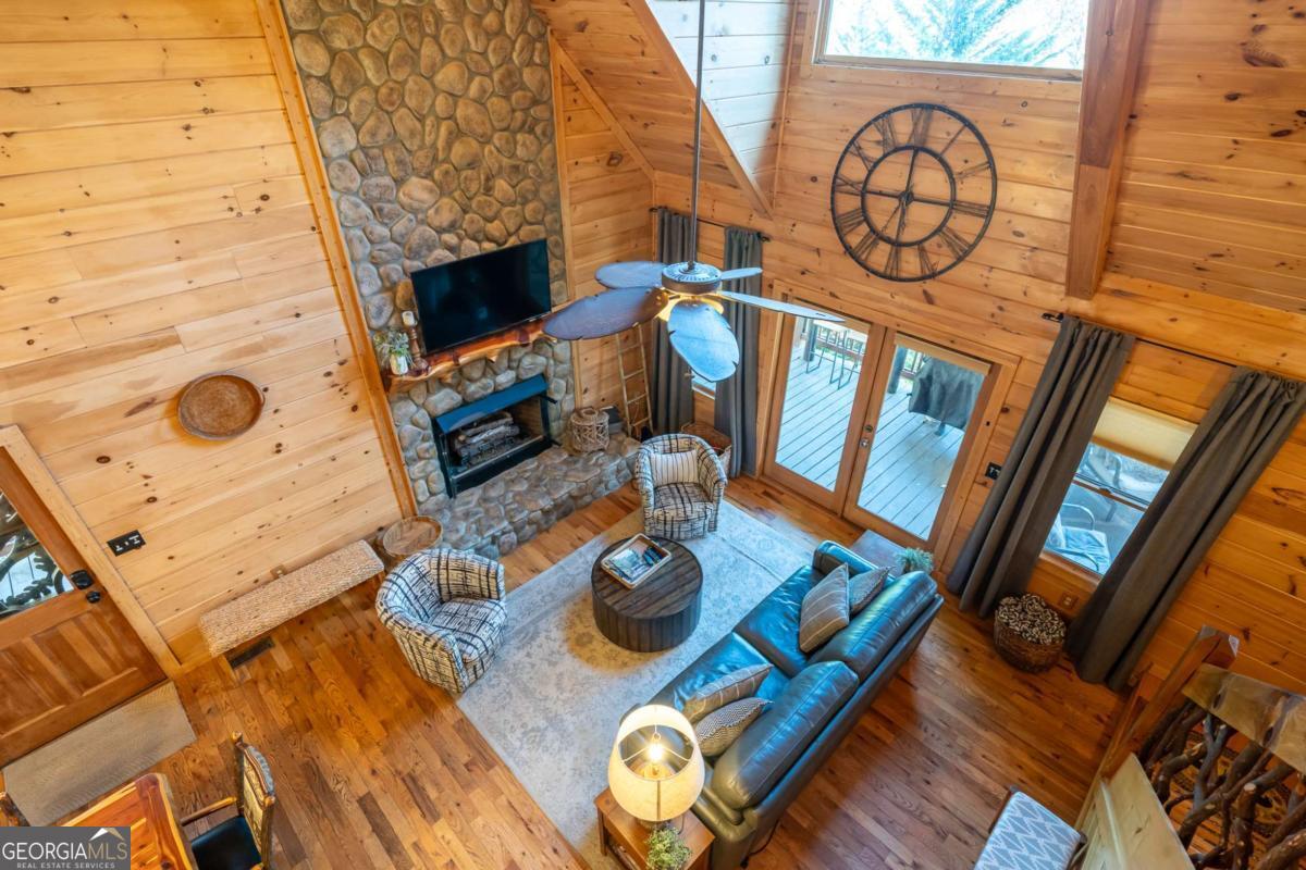 165 Christian Crossing, Unit 15 Morganton, GA 30560 - Photo 33 of 58 a living room with furniture and a fireplace