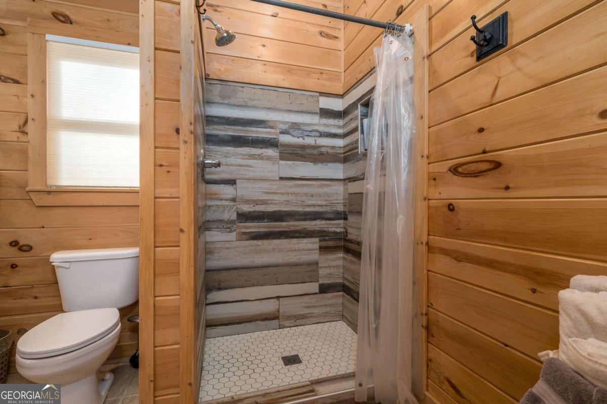 165 Christian Crossing, Unit 15 Morganton, GA 30560 - Photo 39 of 58 a bathroom with a toilet and a shower