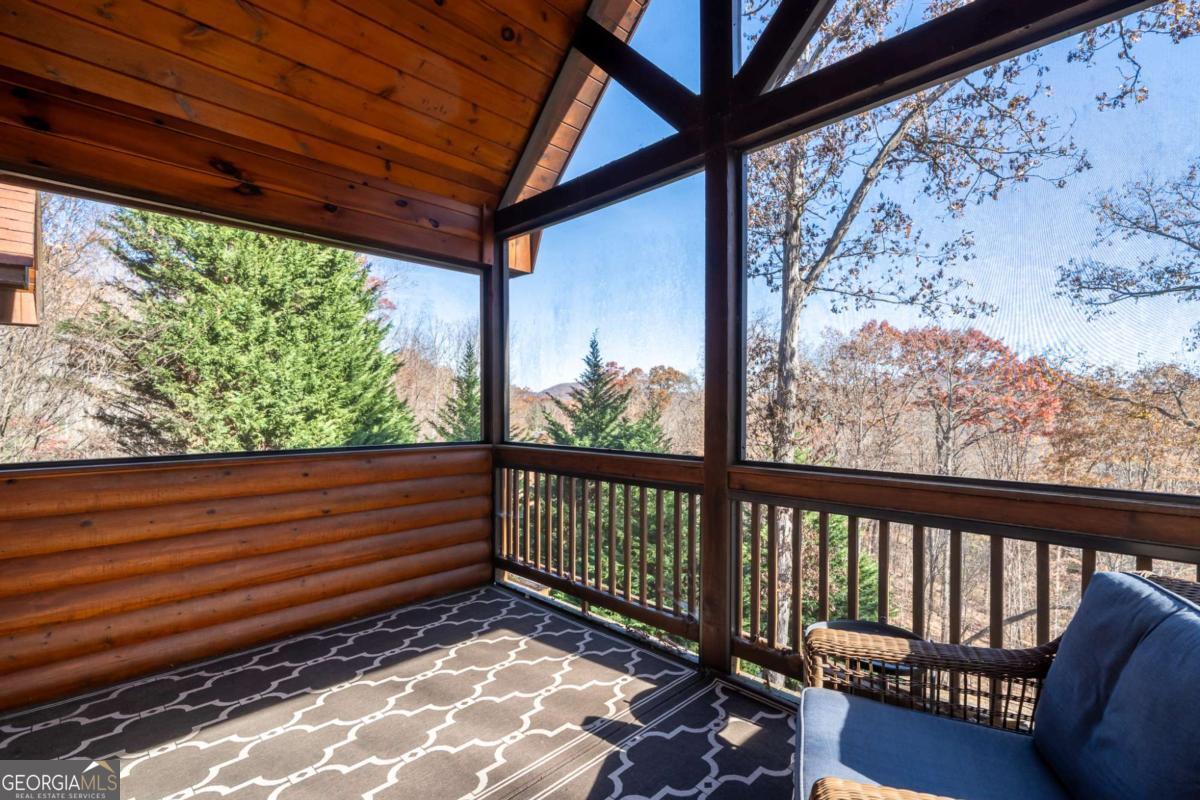 165 Christian Crossing, Unit 15 Morganton, GA 30560 - Photo 41 of 58 a view of a wooden bench in a balcony