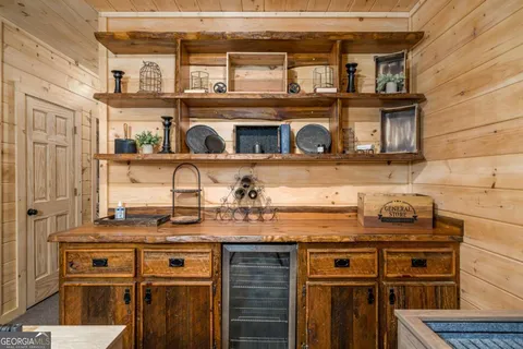 a view of a porch with furniture and wooden floor