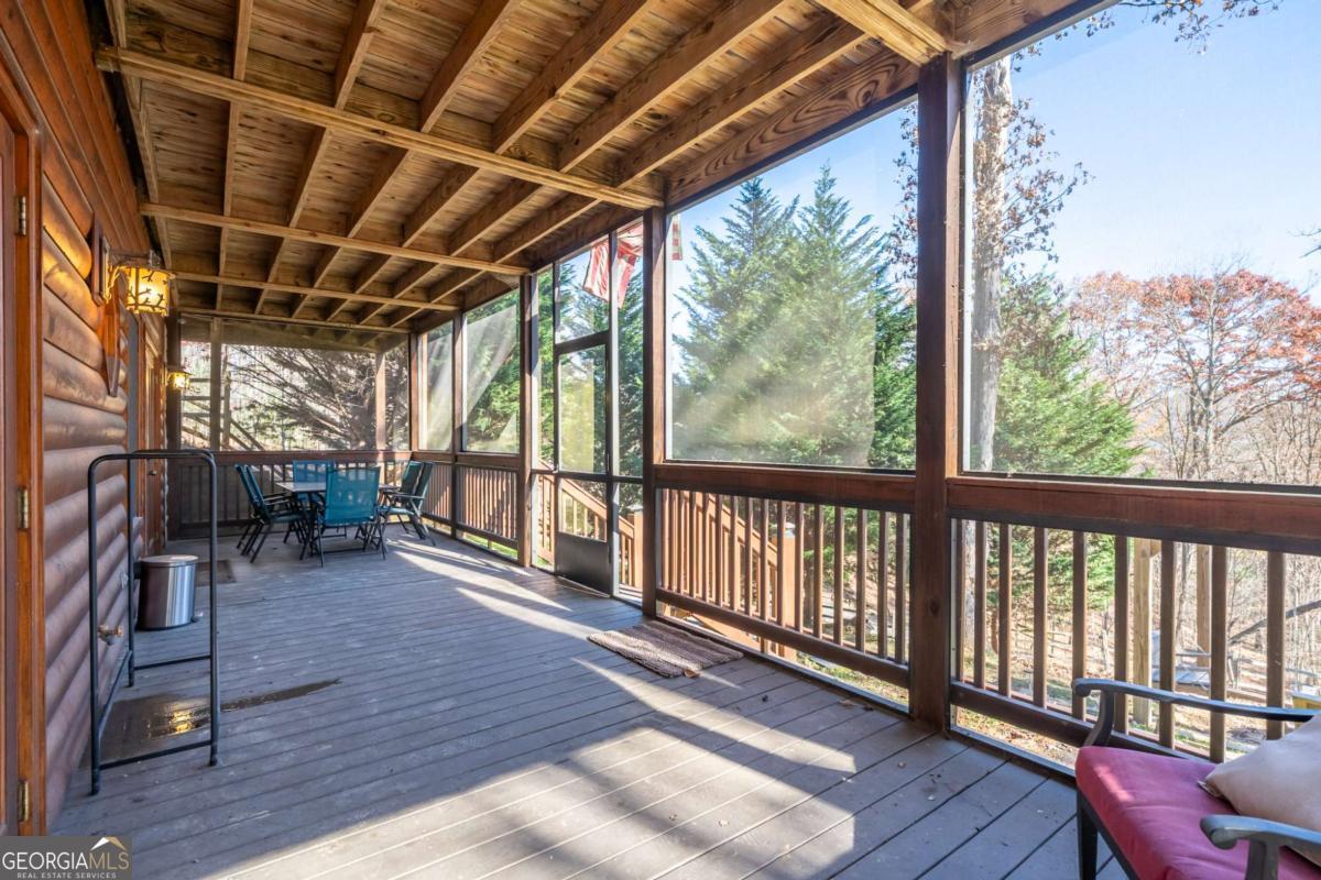 165 Christian Crossing, Unit 15 Morganton, GA 30560 - Photo 52 of 58 a view of a porch with wooden floor