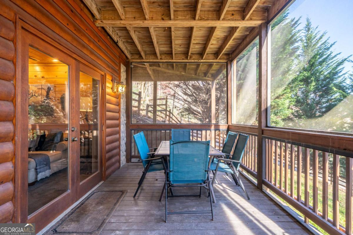 165 Christian Crossing, Unit 15 Morganton, GA 30560 - Photo 53 of 58 a view of a porch with furniture and wooden floor