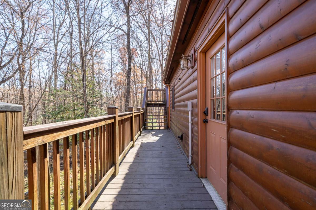 165 Christian Crossing, Unit 15 Morganton, GA 30560 - Photo 9 of 58 a view of balcony with wooden floor and fence