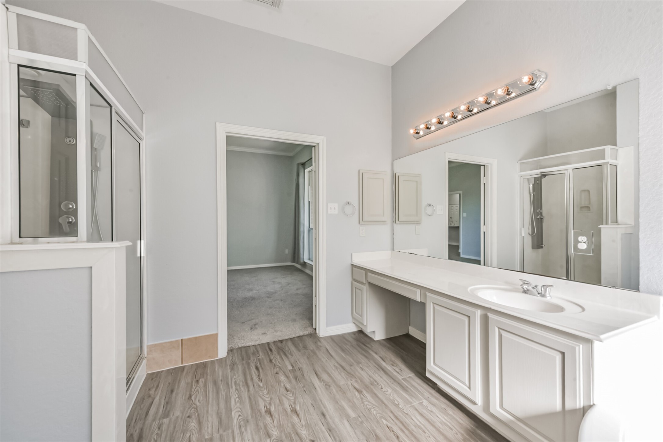 19346 Dickson Park Drive Spring, TX 77373 - Photo 12 of 31 a spacious bathroom with a double vanity sink and a mirror