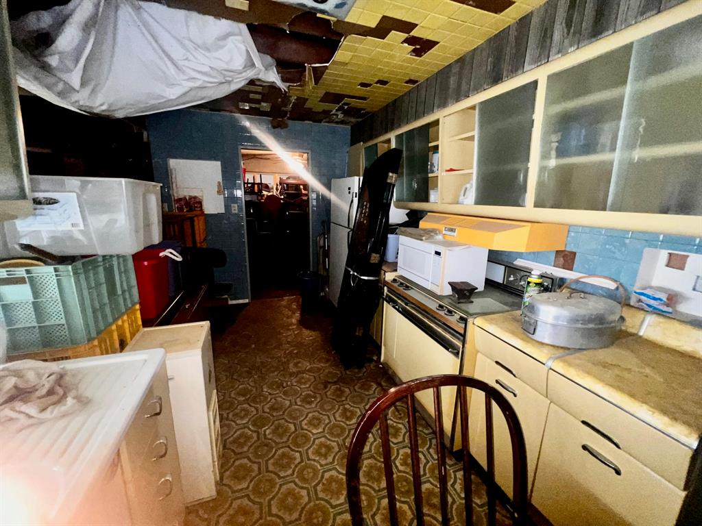 3613 Williams Road Fort Worth, TX 76116 - Photo 20 of 31 a kitchen with stainless steel appliances granite countertop a sink a stove and a wooden floors
