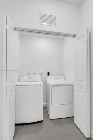 a bathroom with a sink toilet and a mirror