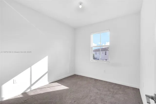 a view of a house with backyard and garden