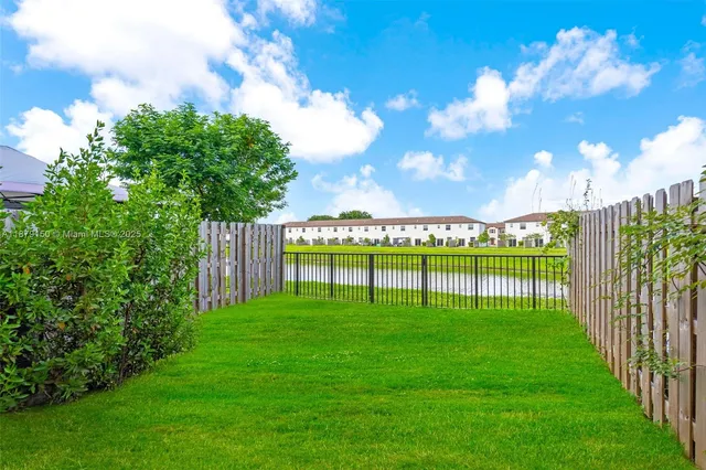 a view of a lake with a big yard