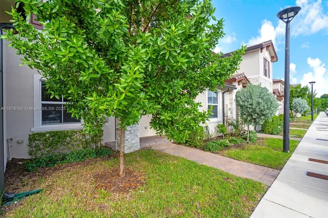 a house view with a garden space