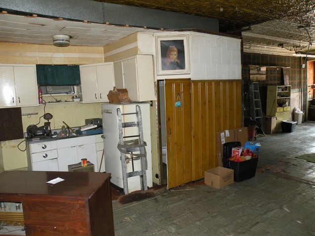 7235 Roosevelt Road Forest Park, IL 60130 - Photo 11 of 12 a kitchen with stainless steel appliances granite countertop a refrigerator and a stove top oven