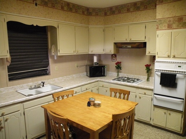 7235 Roosevelt Road Forest Park, IL 60130 - Photo 8 of 12 a kitchen with a stove a sink and a refrigerator