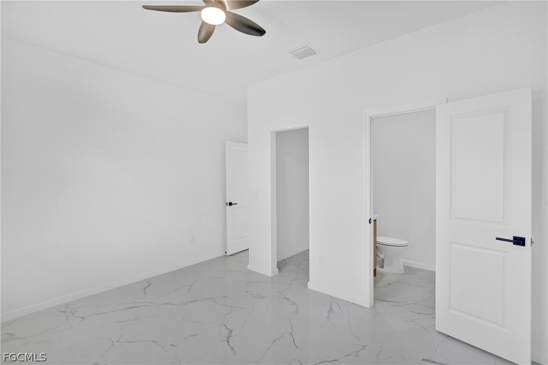 5231 6th Street West Lehigh Acres, FL 33971 - Photo 13 of 26 wooden floor in an empty room