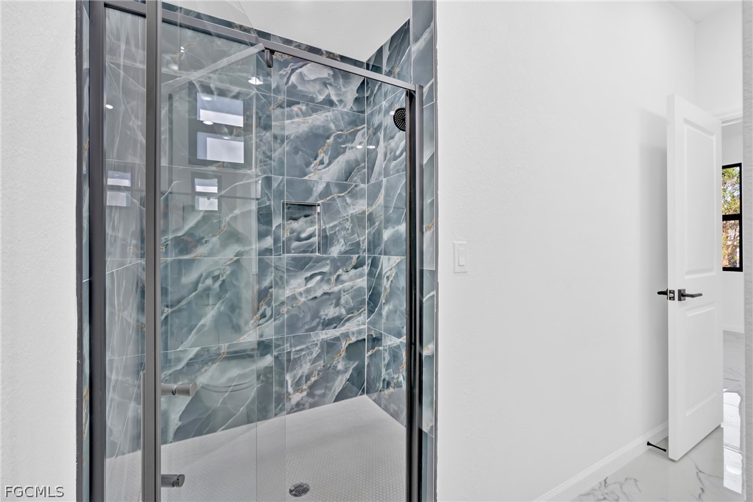 5231 6th Street West Lehigh Acres, FL 33971 - Photo 24 of 26 a bathroom with a shower