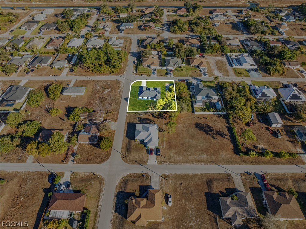 5231 6th Street West Lehigh Acres, FL 33971 - Photo 26 of 26 an aerial view of residential houses with outdoor space