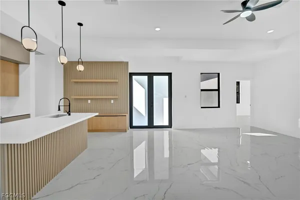 a spacious bathroom with a double vanity sink a mirror and bathtub