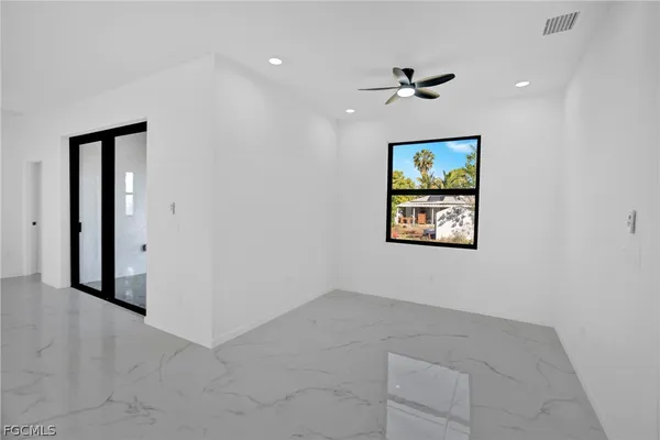 an empty room and window