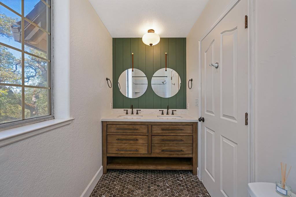 3154 Twin K Road Pilot Hill, CA 95664 - Photo 63 of 89 a bathroom with a sink and a mirror