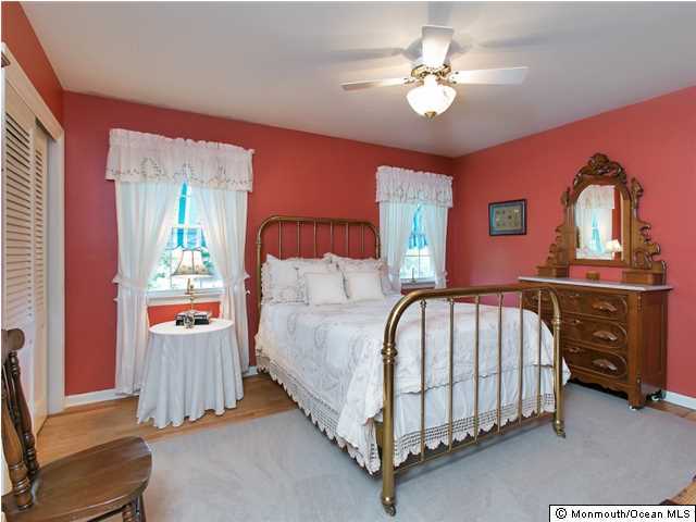 32 Woodhollow Road Colts Neck, NJ 07722 - Photo 12 of 23 a bed room with a bed and a ceiling fan