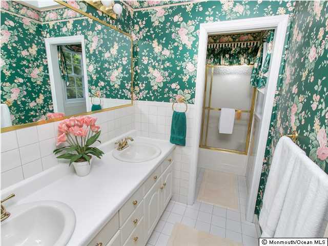 32 Woodhollow Road Colts Neck, NJ 07722 - Photo 13 of 23 a bath room with a sink and mirror