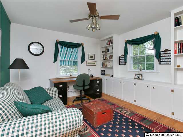 32 Woodhollow Road Colts Neck, NJ 07722 - Photo 14 of 23 a bedroom with furniture and a window