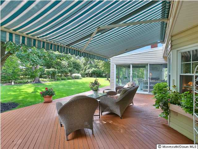 32 Woodhollow Road Colts Neck, NJ 07722 - Photo 15 of 23 a house view with a seating space and garden