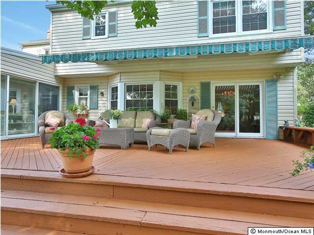 32 Woodhollow Road Colts Neck, NJ 07722 - Photo 17 of 23 a view of a house with a potted plant